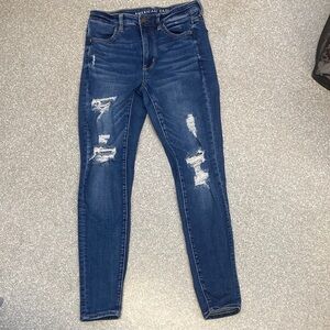 American Eagle Outfitters Women's Ripped Dark Blue Skinny Jeans. Size 4 EUC